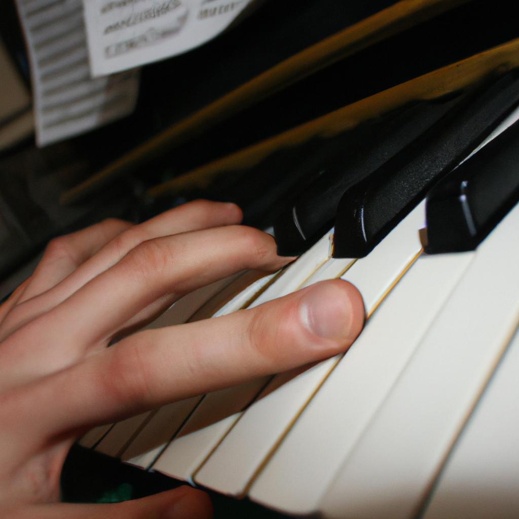 Person playing piano, writing music