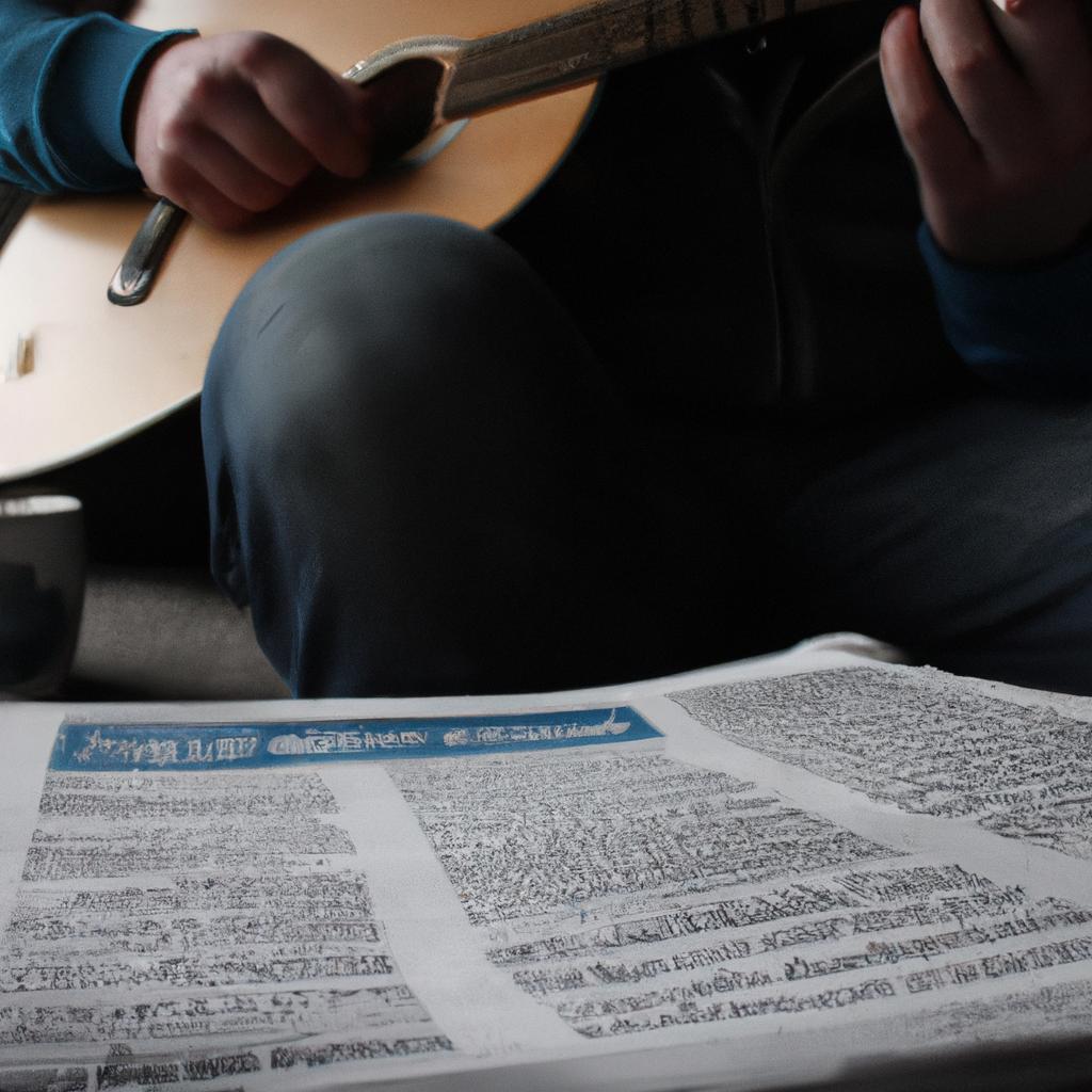 Person playing guitar, reading newspaper